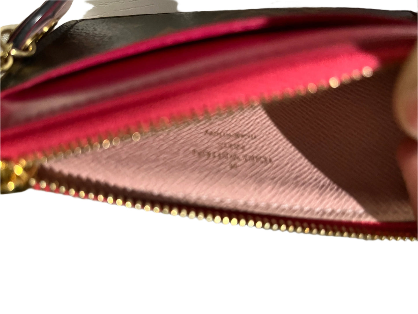 Louis Vuitton mini wallet with charm