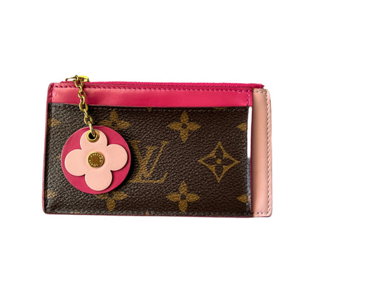 Louis Vuitton mini wallet with charm