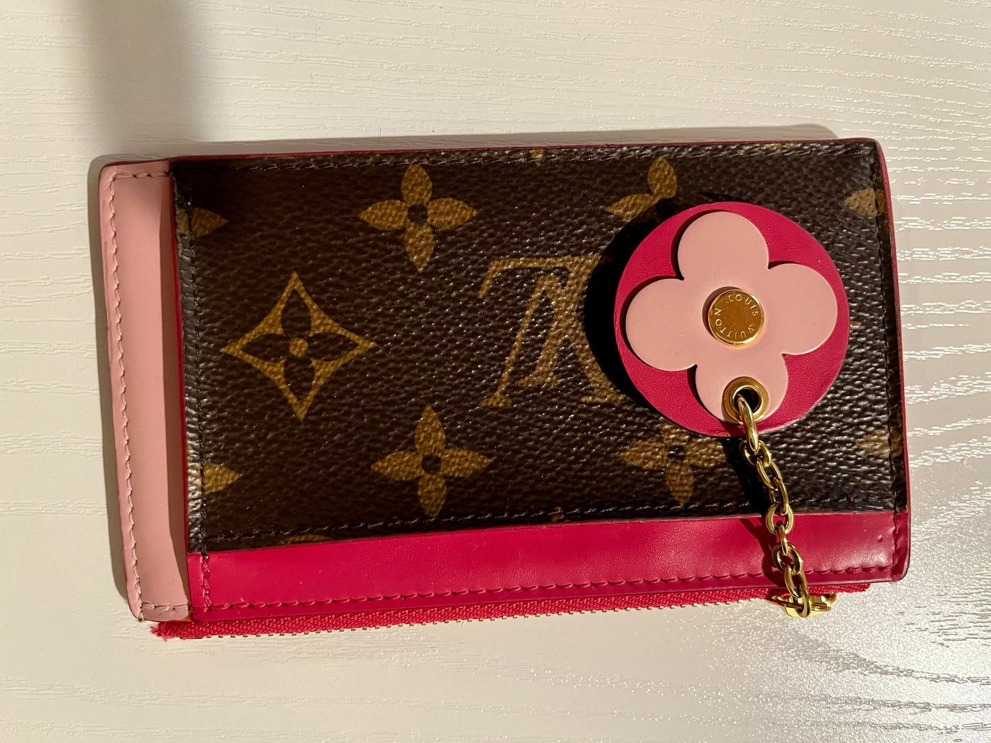 Louis Vuitton mini wallet with charm