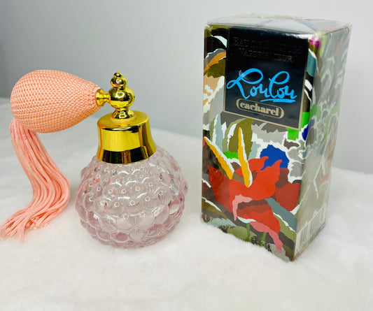 Perfume spray bottle with pink tassel